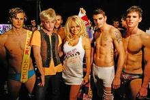 Richie Rich and Pamela Anderson get the male models ready for the runway. Photo / Babiche Martens Richie Rich and Pamela Anderson get the male models ready for the runway. Photo / Babiche Martens