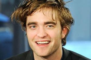 Robert Pattinson says he is useless in love. Photo / AP