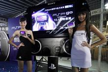 Models at the Tokyo Game Show promoting the new PSP Go. Photo / AP Models at the Tokyo Game Show promoting the new PSP Go. Photo / AP