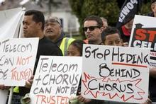 Protestors outside the Telecom annual shareholders meeting at Ellerslie, Aucklamd this morning. Photo / NZPA Protestors outside the Telecom annual shareholders meeting at Ellerslie, Aucklamd this morning. Photo / NZPA