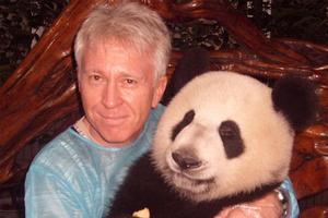 Phil Taylor and gentlepanda All the Best share a special moment at China's Chengdu giant panda breeding base. Photo / Phil Taylor