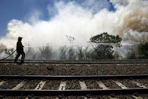 Firefighters had to douse four scrub fires near South Auckland railway lines yesterday. Photo / Steven McNicholl