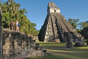 Tourists explore the Mayan ruins at Tikal. Photo / Supplied
