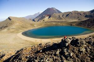 The Tongariro Crossing track descends steeply down loose scree to the eye-catching Emerald Lakes. Photo / Destination Taupo