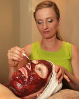 Therapist Ildiko Zoldi paints chocolate onto a client's face at East Day Spa. Photo / Martin Sykes Therapist Ildiko Zoldi paints chocolate onto a client's face at East Day Spa. Photo / Martin Sykes