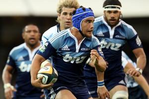 Benson Stanley of the Blues runs the ball forward during the round eight Super 14 match. Photo / Getty Images