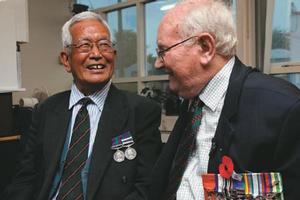 John Masters, 75, (right) laughs with Hariprasad Gurung, 76, during a reunion at Christchurch's Papanui RSA. Photo / Simon Baker