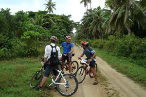 Cyclists take a break during Niue's Rally of the Rock. Photo / Paul Johnson