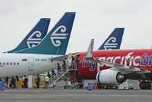 Virgin Blue, which owns Pacific Blue, and Air New Zealand hope to strike a deal which would increase passenger numbers across the Tasman. Photo / Brett Phibbs Virgin Blue, which owns Pacific Blue, and Air New Zealand hope to strike a deal which would increase passenger numbers across the Tasman. Photo / Brett Phibbs