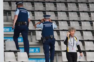 Tournament director Brenda Perry waits as police check the stands after an unattended bag was found. Photo / Brett Phibbs