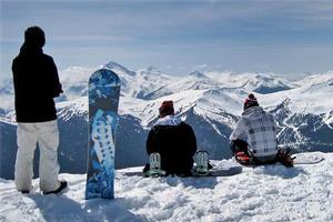 Snowboarders take in the view from the top of Whistler Blackcomb. Photo / Sarah Ivey