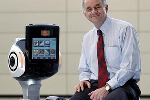Dr Bruce MacDonald with a healthbot which can respond to a range of patient needs. Photo / Sarah Ivey