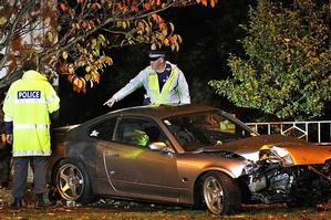 Christchurch police with the car that killed the 4-year-old and seriously hurt his 6-year-old brother after its teenage driver lost control and drove onto the footpath. Photo / Martin Hunter