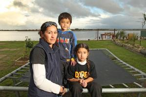 Residents such as Rachael Thomas, here with her children Jason and Tessa, have been told they have to leave their homes in Little Waihi. Photo / Alan Gibson