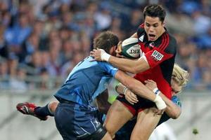 Crusaders winger Sean Maitland is picked up by the Bulls defence during this morning’s Super 14 semifinal in Soweto. Photo / Getty Images