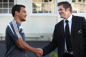 New All Blacks player Benson Stanley, left, is congratulated by captain Richie McCaw after the naming of the All Blacks squad. Photo / Brett Phibbs