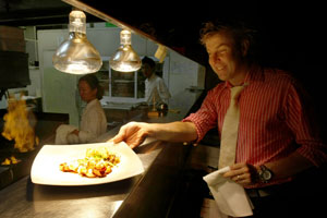 Jeremy Turner prepares to deliver a plate from the Cibo kitchen. Photo / Steven McNicholl