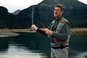 Telecom CEO Paul Reynolds appears fishing near Glenorchy in an ad promoting XT as the 'anywhere' network. Photo / Supplied