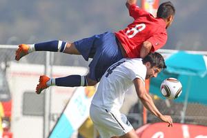 Rory Fallon is first to the ball in the All Whites' friendly against Chile at Kanyamazane Stadium early today. Photo / Brett Phibbs