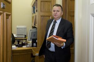 Shanes Jones clutches credit card statements which will kill his political career. Photo / Mark Mitchell