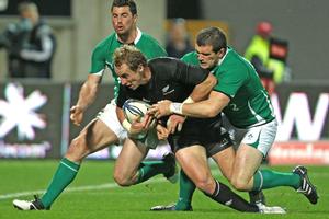Jimmy Cowan of the All Blacks scores his second try against Ireland. Photo / Getty Images