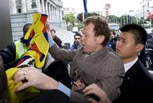Green Party co-leader Russel Norman is restrained during the scuffle with Chinese security over his Tibetan flag. Photo / Mark Mitchell Green Party co-leader Russel Norman is restrained during the scuffle with Chinese security over his Tibetan flag. Photo / Mark Mitchell