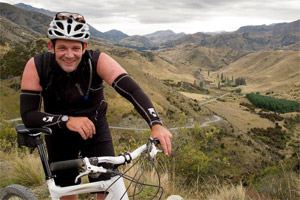 New Zealand Herald photographer Greg Bowker stops during his 40km ride towards Cob Cottage near Molesworth Station after leaving Upcot Station during day two on route to Hanmer Springs. Photo / Greg Bowker