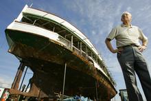 Jim McPhillips stands in front of the Toroa steamship, 2008. Photo / The Aucklander. Jim McPhillips stands in front of the Toroa steamship, 2008. Photo / The Aucklander.