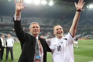 All Whites coach Ricki Herbert and John Key share a moment at the World Cup. Photo / Brett Phibbs