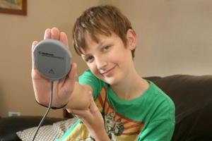 A magnet-like scanner transmits data from Zachary Lutter's pacemaker over the phone to his doctor in Auckland. Photo / Supplied