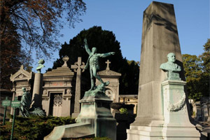 Sculptural headstones and trees make walking through Pere Lachaise Cemetery pleasant. Photo / Liz Light