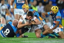 Matt Gillett of the Broncos forces his way to the try line during the round 19 NRL match between the Gold Coast Titans and the Brisbane Broncos. Photo / Getty Images Matt Gillett of the Broncos forces his way to the try line during the round 19 NRL match between the Gold Coast Titans and the Brisbane Broncos. Photo / Getty Images