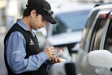 Parking warden Nazim Molla at work in Federal St, Auckland. Photo / Doug Sherring Parking warden Nazim Molla at work in Federal St, Auckland. Photo / Doug Sherring
