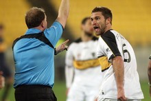 Tim Brown gets cautioned during Friday night's match. Photo / Getty Images Tim Brown gets cautioned during Friday night's match. Photo / Getty Images