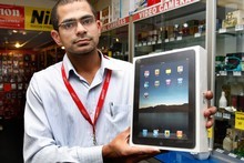 Parallel Imported Queen St store manager Anshul Choudhary holds an Apple iPad, which they have been selling instore for about a month. Photo / Brett Phibbs Parallel Imported Queen St store manager Anshul Choudhary holds an Apple iPad, which they have been selling instore for about a month. Photo / Brett Phibbs