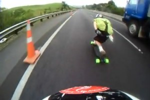 Longboarding down the Bombay Hills at 100 km/h. Photo / Supplied
