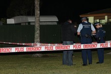 The scene where a man was shot by police in west Auckland on Sunday night. Photo / Natalie Slade The scene where a man was shot by police in west Auckland on Sunday night. Photo / Natalie Slade