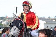 Kaye Manning leads Bruce Almighty and jockey Paul Taylor back after their win. Photo / APN Kaye Manning leads Bruce Almighty and jockey Paul Taylor back after their win. Photo / APN