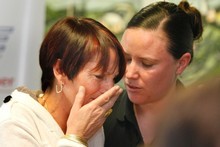 Teresa Scott is comforted by a policewoman after breaking down when asked if she was prepared for the possibility her daughter may not be found alive. Photo / Steven McNicholl Teresa Scott is comforted by a policewoman after breaking down when asked if she was prepared for the possibility her daughter may not be found alive. Photo / Steven McNicholl
