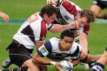 Atieli Pakalani of Auckland is tackled by Scott Uren (L) and Tom Chamberlain of North Harbour. Photo / Getty Images Atieli Pakalani of Auckland is tackled by Scott Uren (L) and Tom Chamberlain of North Harbour. Photo / Getty Images