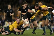 Kieran Read is grabbed but Richie McCaw is on hand to help out. Photo / Getty Images Kieran Read is grabbed but Richie McCaw is on hand to help out. Photo / Getty Images