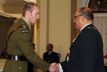 Lieutenant Timothy O'Donnell receives his Distinguished Service Decoration from the Governor-General. Photo / NZDF Lieutenant Timothy O'Donnell receives his Distinguished Service Decoration from the Governor-General. Photo / NZDF
