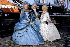 Women in Georgian costume with the HMS Trincomalee. Photo / Chris Armstrong