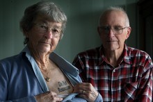 Jan Follas, pictured with husband Eric, has 'do not resuscitate' tattooed on her chest. Photo / APN 