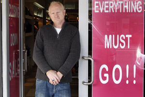 Retailer Carl Webb (left) says Broadway (right), hit by empty shops, shut-up businesses and closing-down sales, is 'totally dead now'. Photos / Sarah Ivey