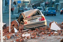 A car, destroyed by falling rubble, on Madras Street in central Christchurch. Photo / NZPA A car, destroyed by falling rubble, on Madras Street in central Christchurch. Photo / NZPA