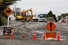 Road workers begin the task of cleaning up debris. Photo / Getty Images Road workers begin the task of cleaning up debris. Photo / Getty Images