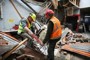 Cleaning up after the Christchurch earthquake. Photo / Greg Bowker