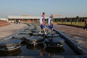 Scottish athletes walk on a fountain at the Commonwealth Games village in New Delhi, India. Photo / AP