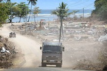 A truck weaves its way through Lalomanu, after last year's tsunami. Photo / Greg Bowker A truck weaves its way through Lalomanu, after last year's tsunami. Photo / Greg Bowker
